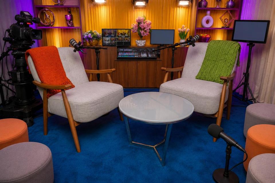 A wide view of the Casa Media Network set in Nairobi, lit for camera with two chairs at its centre, a vision-mixing desk behind them and audience seating around the edge.